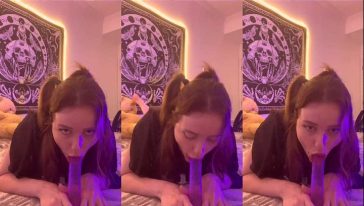 Gostosinha chupando e enfiando o brinquedo sexual na bucetinha